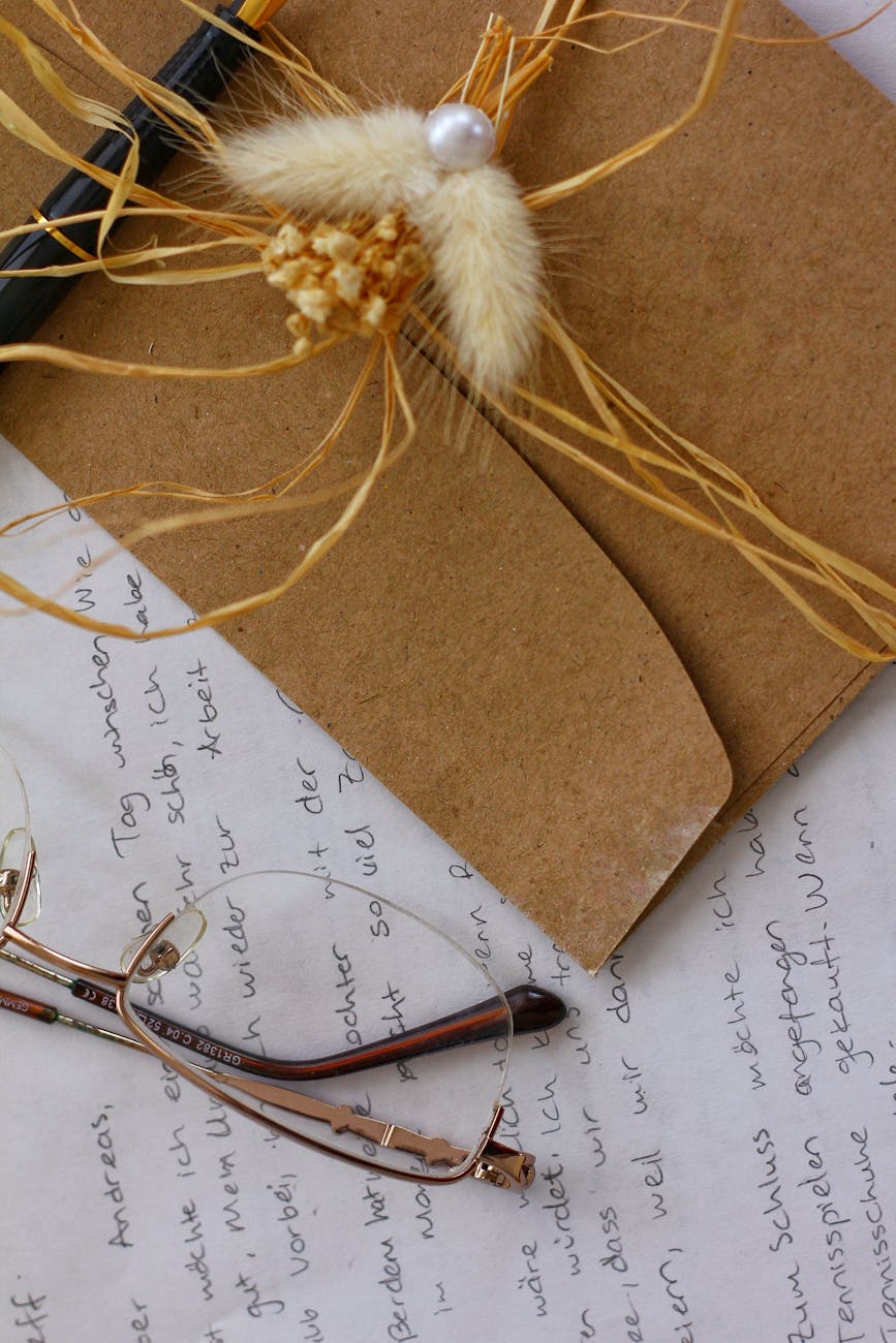 artistic flat lay of writing and accessories